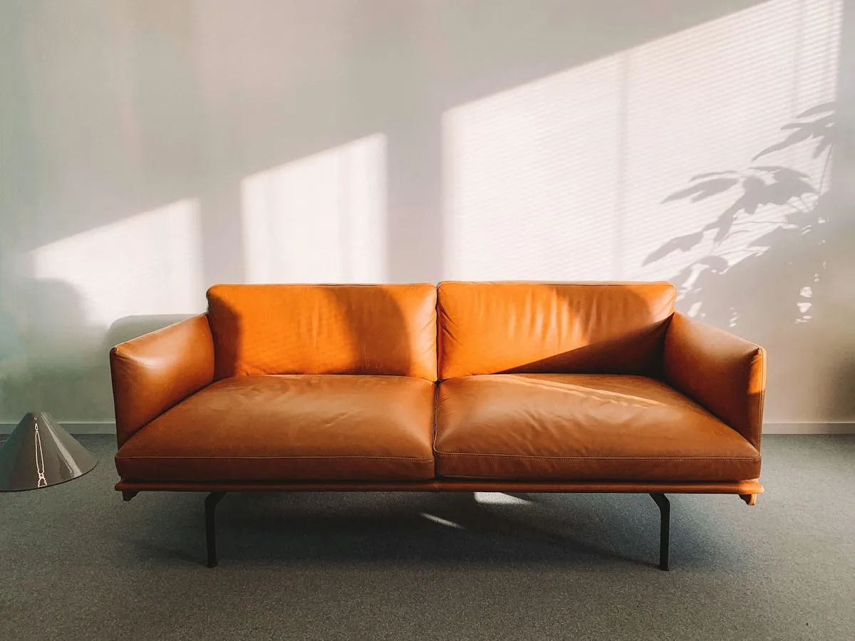 Rust-coloured sofa in a minimal interior