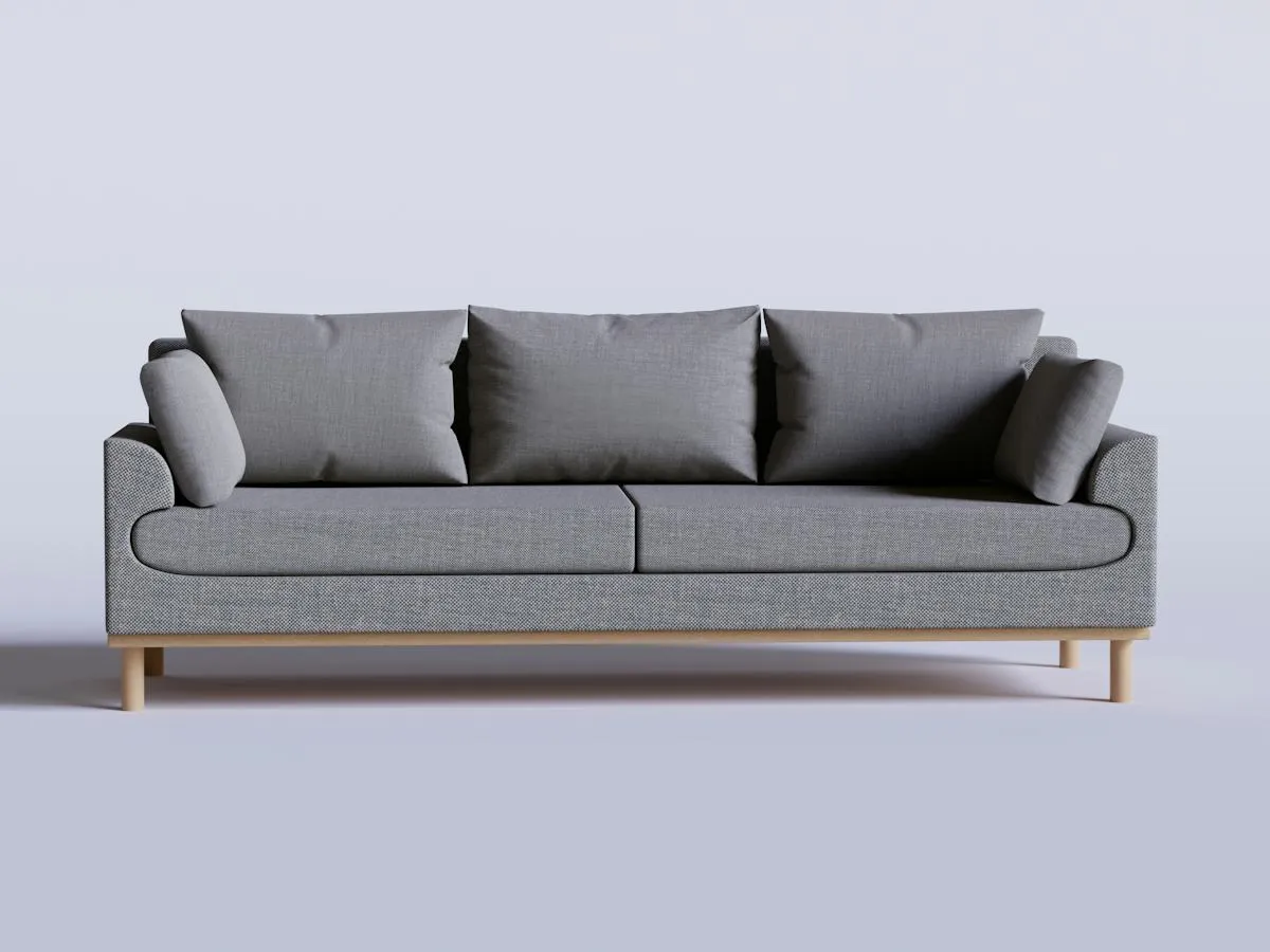 Contemporary grey sofa on a light background